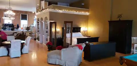 Open loft with seating and the 1875 pool table